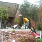 Student volunteers help to cleanup the Holy Land Garden. 