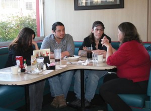 Pictured (L-R) Mary Goodhue, executive assistant of Trey’s House; Trey Ibarra, executive director of Trey’s House; Trey Griffith; and Maggie Griffith, founder of Trey’s House; meet for a strategy session on Friday, Jan. 13.