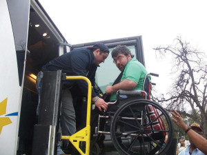 Alumnus Trey Ibarra assists a member of Trey’s House during the non-profit’s yearly trip to the Texas State Capitol.