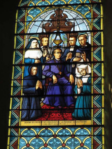 A stained glass tribute to Bishop Claude Marie Dubuis in the parish church in the village of Coutouvre, France.