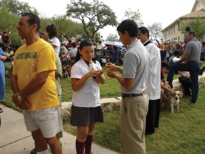 Vasquez blesses an animal during the Feast Day of St. Francis while in high school.