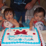 Myra Alvarez-Garza twins at party with 1st cake.2 JPG