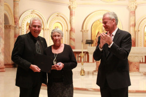 UIW President Dr. Louis Agnese and current Chairman of the Board of Trustees Charles D. Lutz, III present a certificate and UIW commemorative diamond pin of recognition to Spana at the 20th annual Heritage Day Employee Recognition Ceremony held Oct. 9 in the Chapel of the Incarnate Word. 