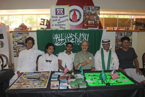 Abdullah Madkhaly (second from right), a government-sponsored student and president of the Saudi Student Club; Phil Youngblood (center), computer information systems instructor; and members of the Saudi Student Club pose for a photo at Saudi Arabia National Day.