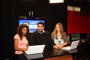 Students prepare for a broadcast in UIW’s meteorology broadcast studio.