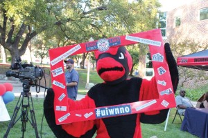 Red poses at the 2014 National Night Out event. 