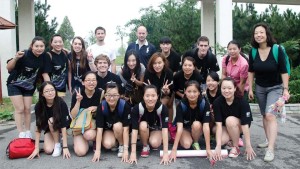 Danz (kneeling, fourth from left) on a group outing to a Chinese city called Qingdao, where they enjoyed authentic cuisine and hot springs.