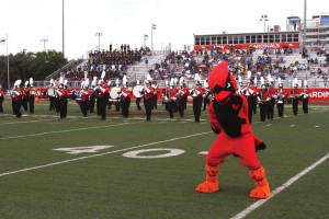 The Marching Cardinals and Red perform during the first football game of the 2015 season. 