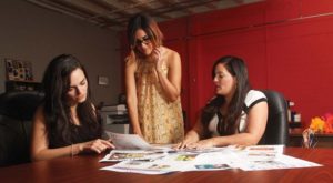 Morales, Duran and Najera review La Prensa layouts at their office in downtown San Antonio.