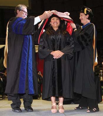 Teves with Dr. Forrest Aven (left), HEBSBA dean, and Craven (right) during spring commencement.