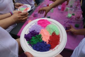 Students prepare dye for color throwing. 