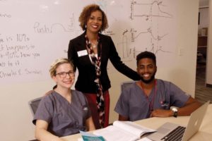 Dawson (center) visits with Bell and Voice at UIW’s medical school at Brooks City Base.