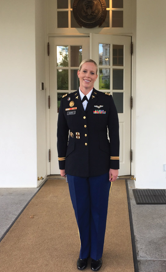 Maj. Betty Moore stands proudly at the White House.