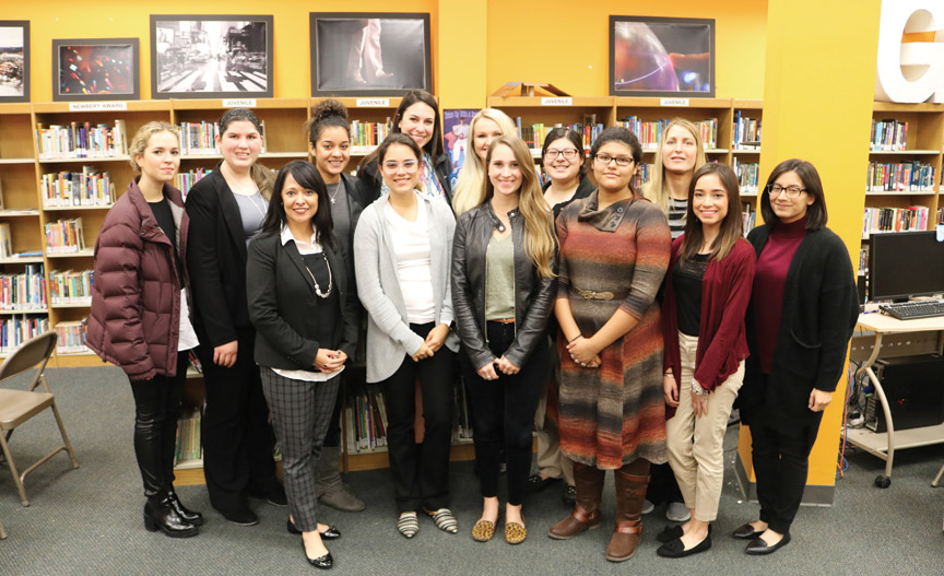 Dr. Elda Martinez, third from left, and her education class at an education symposium.