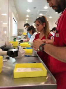 Students from the Rosenberg School of Optometry painstakingly work on corrective eyeglasses in their mobile unit during an ARISE health mission trip to the Rio Grande Valley last year. RSO students and volunteers assisted hundreds of patients with eye exams and provided eye health information.