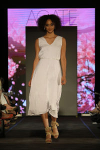 model in white dress at the Cutting Edge Fiesta Fashion Show