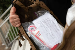 UIWSOM students pack their medical backpacks with essential supplies.