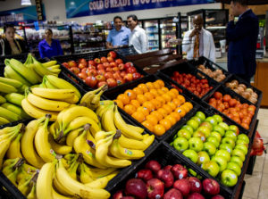 Red Rooster Food Mart filled bins with fresh fruits and vegetables distributed by River City Produce.